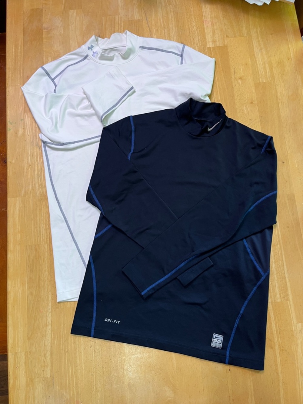 2 Nike Dri-FIT and Under Armour Long Sleeve Tops -White & Navy w/ Blue Stitching